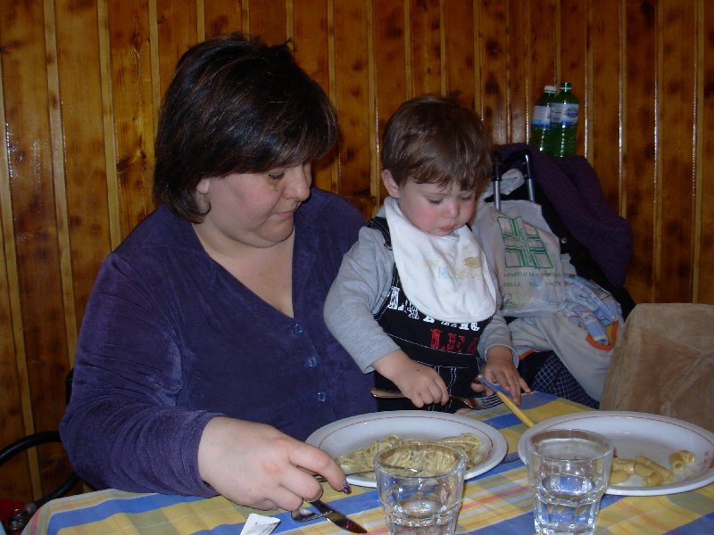 giulcenc's wife and child while they're eating 